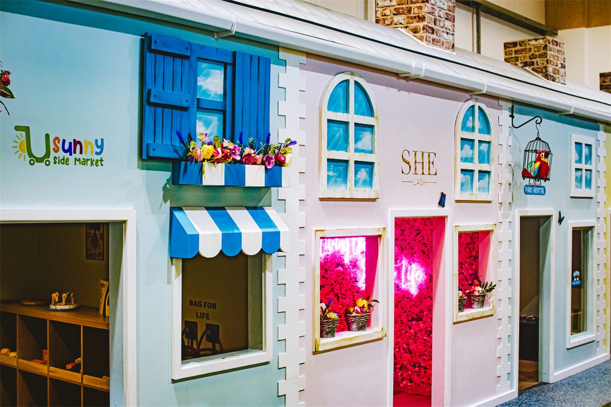 Sunnyside Market and SHE Lash themed shop fronts at Giggle Street Shrewsbury